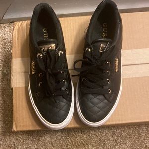 Womans or girls size 6 1/2 GUESS Black Tufted Tennis Shoes